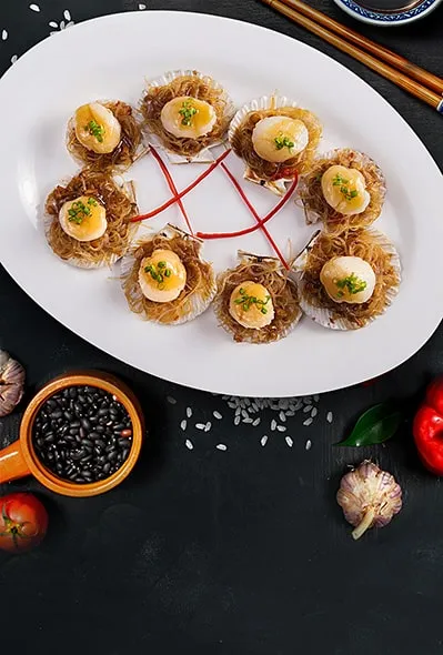 Морські гребінці з часниковим соусом